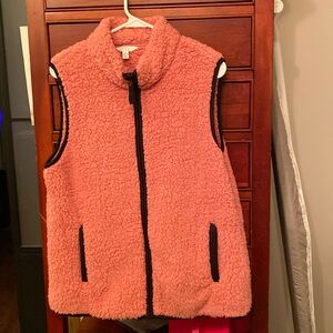 Warm fluffy pink vest. Good condition. Never worn. Zip down.